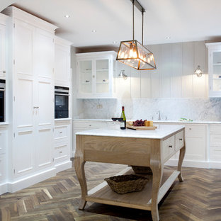 Large transitional kitchen pantry appliance - Kitchen pantry - large transitional u-shaped dark wood floor kitchen pantry idea in Dublin with a single-bowl sink, white cabinets, quartz countertops, white backsplash, stainless steel appliances and an island