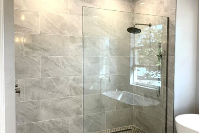Inspiration for a mid-sized contemporary master gray tile and porcelain tile porcelain tile and white floor bathroom remodel in Other with shaker cabinets, white cabinets, gray walls, quartz countertops and a built-in vanity