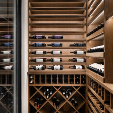 Modern Glass-Enclosed Wine Cellar with Custom Oak Racking | Chicago