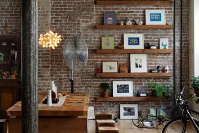 Mid-sized urban light wood floor great room photo in New York with brown walls and no fireplace