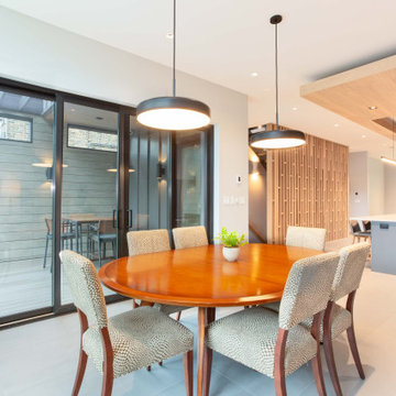 Indoor-Outdoor Dining Room with Seamless Transition and Organic Touches