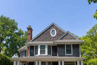 Inspiration for a large contemporary gray two-story stucco and clapboard house exterior remodel in Chicago