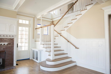 Mid-sized elegant wooden straight wood railing staircase photo in Newark with wooden risers
