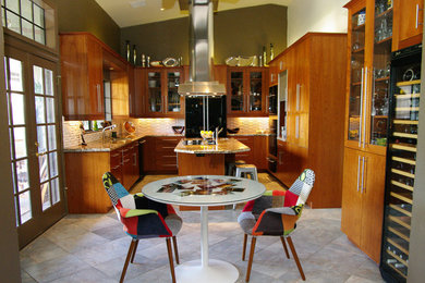 Eat-in kitchen - huge contemporary u-shaped ceramic tile eat-in kitchen idea in Phoenix with a drop-in sink, flat-panel cabinets, medium tone wood cabinets, granite countertops, white backsplash, ceramic backsplash, stainless steel appliances and an island