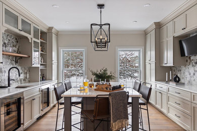 Inspiration for a mid-sized transitional medium tone wood floor and brown floor dining room remodel in Burlington with white walls