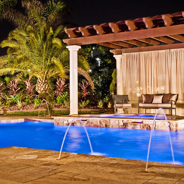 Roman/Geometric Pool with Pergola, Custom Spa, and Laminar Deck Jets in Davie, F