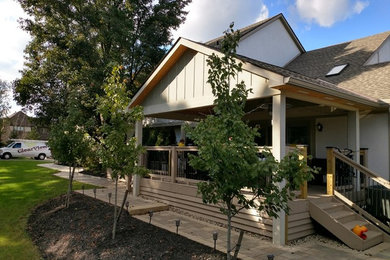Large back porch photo in Columbus with a roof extension