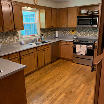 Cabinet reface antique white cabinets.. quartz countertop