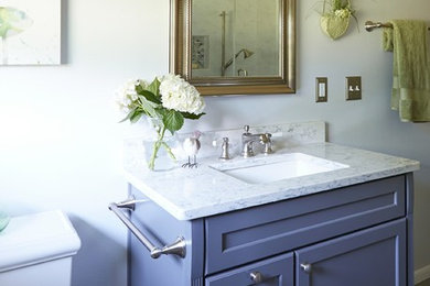 Example of a mid-sized transitional master gray tile ceramic tile bathroom design in Milwaukee with flat-panel cabinets, gray cabinets, a drop-in sink and quartz countertops