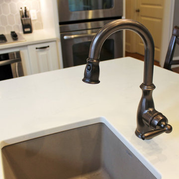 White Kitchen with Espresso Island and Eternia Caringdale Quartz Countertop