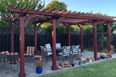 Mid-sized back porch photo in San Francisco with a pergola