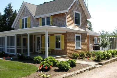 Inspiration for a mid-sized timeless beige two-story wood house exterior remodel in Orange County