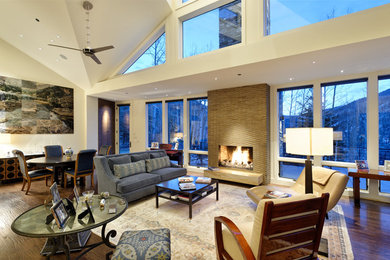 Living room - large contemporary open concept medium tone wood floor living room idea in Denver with white walls, a standard fireplace and a wall-mounted tv