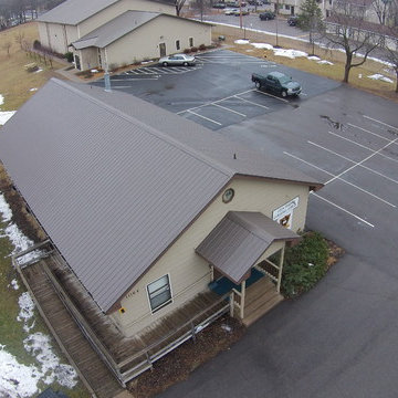 Metal roof and seamless gutters on a Church building