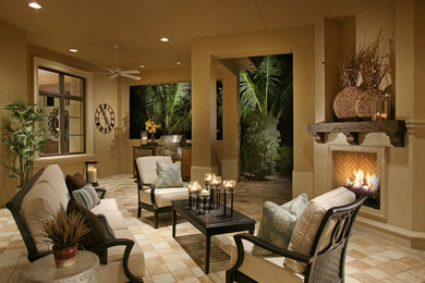 Example of a large tuscan backyard tile patio design in Miami with a fire pit and a roof extension