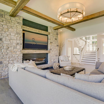 Reclaimed Wood Beams and Mantel in Stone Fireplace Room