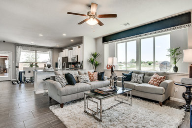 Inspiration for a transitional open concept living room in Austin with grey walls and medium hardwood floors.