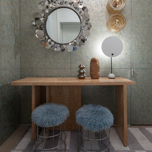 Inspiration for a mid-sized eclectic foyer in New York with grey walls, carpet and grey floor.