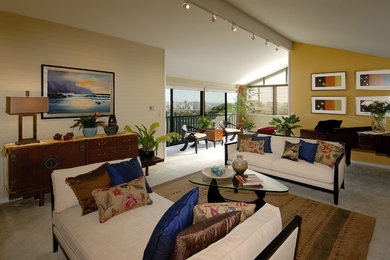 Example of a huge island style loft-style living room design in Hawaii with beige walls