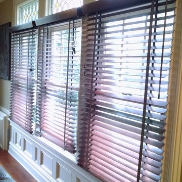 Family Room custom trimmed wall using original stained glass transoms