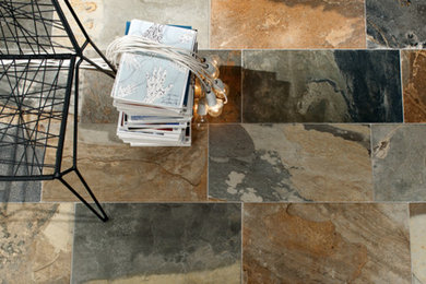 Inspiration for a transitional ceramic tile living room remodel in Orange County with no fireplace