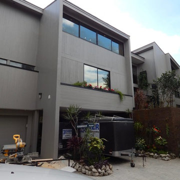 Custom milled cedar siding and cypress window frames