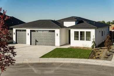 Mid-sized transitional white one-story mixed siding house exterior idea in Boise with a hip roof and a shingle roof