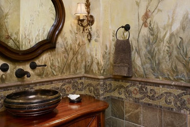 Example of a tuscan powder room design in Denver with a vessel sink