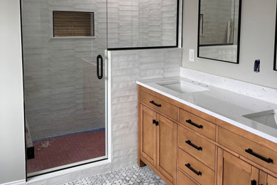 Bathroom - mid-sized transitional ceramic tile double-sink bathroom idea in Detroit with shaker cabinets, light wood cabinets, quartzite countertops and a freestanding vanity