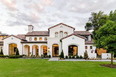 Tuscan white two-story stucco gable roof photo in Dallas