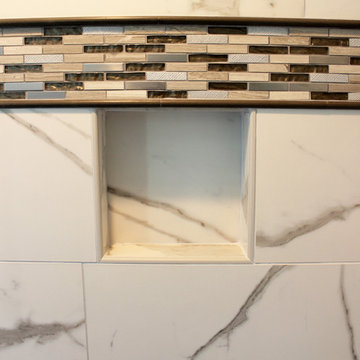 Gray Vanity with Freestanding Tub and Tiled Walkin Shower