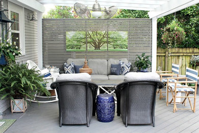 Inspiration for a large craftsman back porch remodel in New Orleans with decking and a pergola