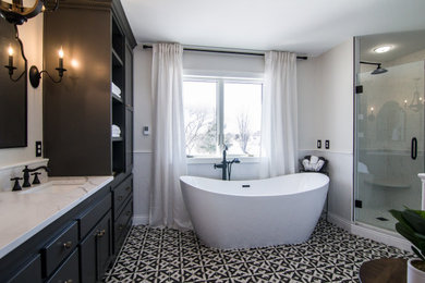 Example of a mid-sized classic master porcelain tile, multicolored floor and double-sink bathroom design in Minneapolis with shaker cabinets, an undermount sink, quartz countertops, a hinged shower door, white countertops, a built-in vanity and black cabinets