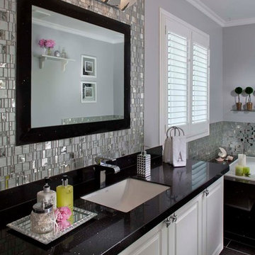 Contemporary black and white bathroom with metallic mosaics