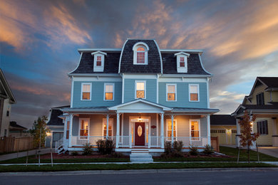 Inspiration for a large craftsman blue two-story wood exterior home remodel in Denver with a shingle roof