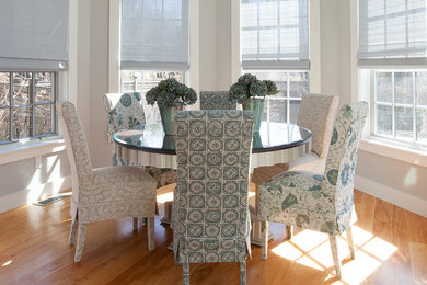 Example of a mid-sized transitional medium tone wood floor and brown floor kitchen/dining room combo design in Boston with gray walls