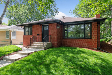 Example of a mid-sized mid-century modern one-story brick house exterior design in Minneapolis