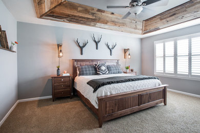 Mid-sized mountain style master carpeted and beige floor bedroom photo in Denver with gray walls and no fireplace