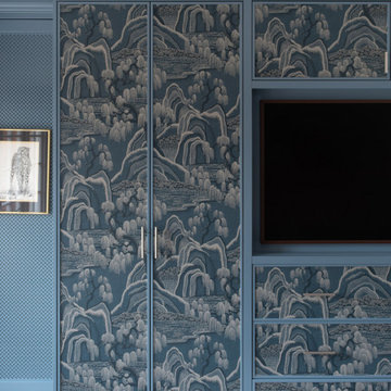 Bespoke fitted wardrobes with wallpapered panels