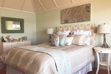 Mid-sized beach style guest medium tone wood floor and brown floor bedroom photo in New York with green walls