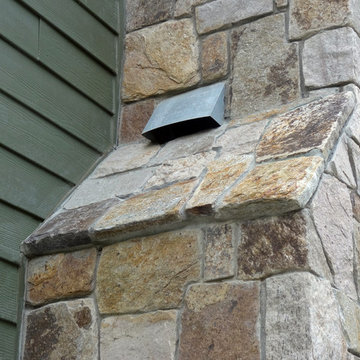 Combining Colonial Tan Natural Stone with Olive Green Siding