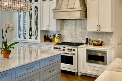 Example of a transitional kitchen design in Dallas with shaker cabinets and two islands