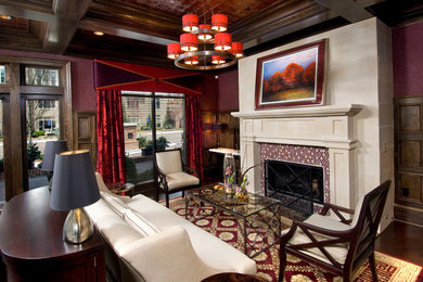 Inspiration for a mid-sized timeless open concept dark wood floor and brown floor living room remodel in Atlanta with white walls, a wall-mounted tv, a standard fireplace and a tile fireplace