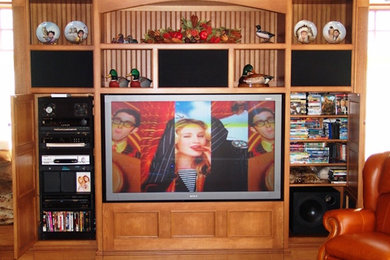 This is an example of a living room in New York with beige walls and a built-in media wall.
