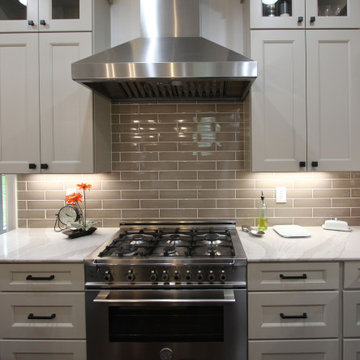 White Kitchen with Espresso Island, Galley Sink, Cambria Britannica Countertop