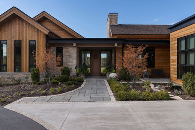 Country home design photo in Milwaukee