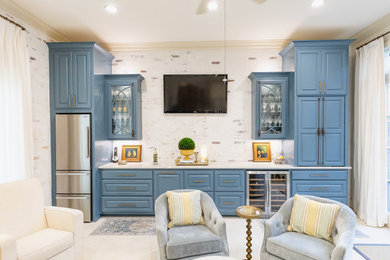 Inspiration for a large transitional u-shaped porcelain tile and white floor eat-in kitchen remodel in New Orleans with a single-bowl sink, raised-panel cabinets, blue cabinets, quartzite countertops, white backsplash, stone slab backsplash, stainless steel appliances, two islands and white countertops