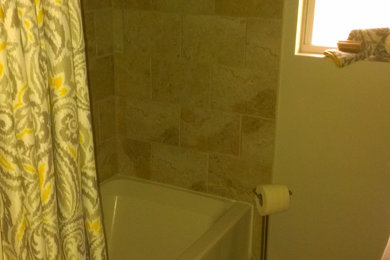 Example of a transitional bathroom design in Other
