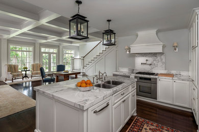 Large l-shaped dark wood floor eat-in kitchen photo in Houston with a double-bowl sink, recessed-panel cabinets, white cabinets, marble countertops, multicolored backsplash, stainless steel appliances and an island