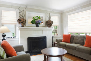 This is an example of a mid-sized contemporary open concept living room in Other with beige walls, medium hardwood floors, a standard fireplace and a brick fireplace surround.